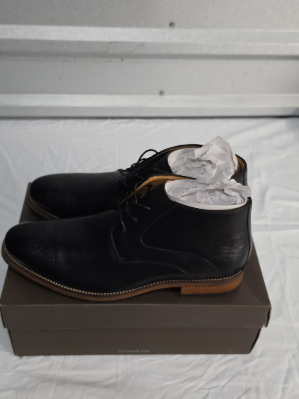 Florsheim Black Leather Chukka Boots with Tan Sole
